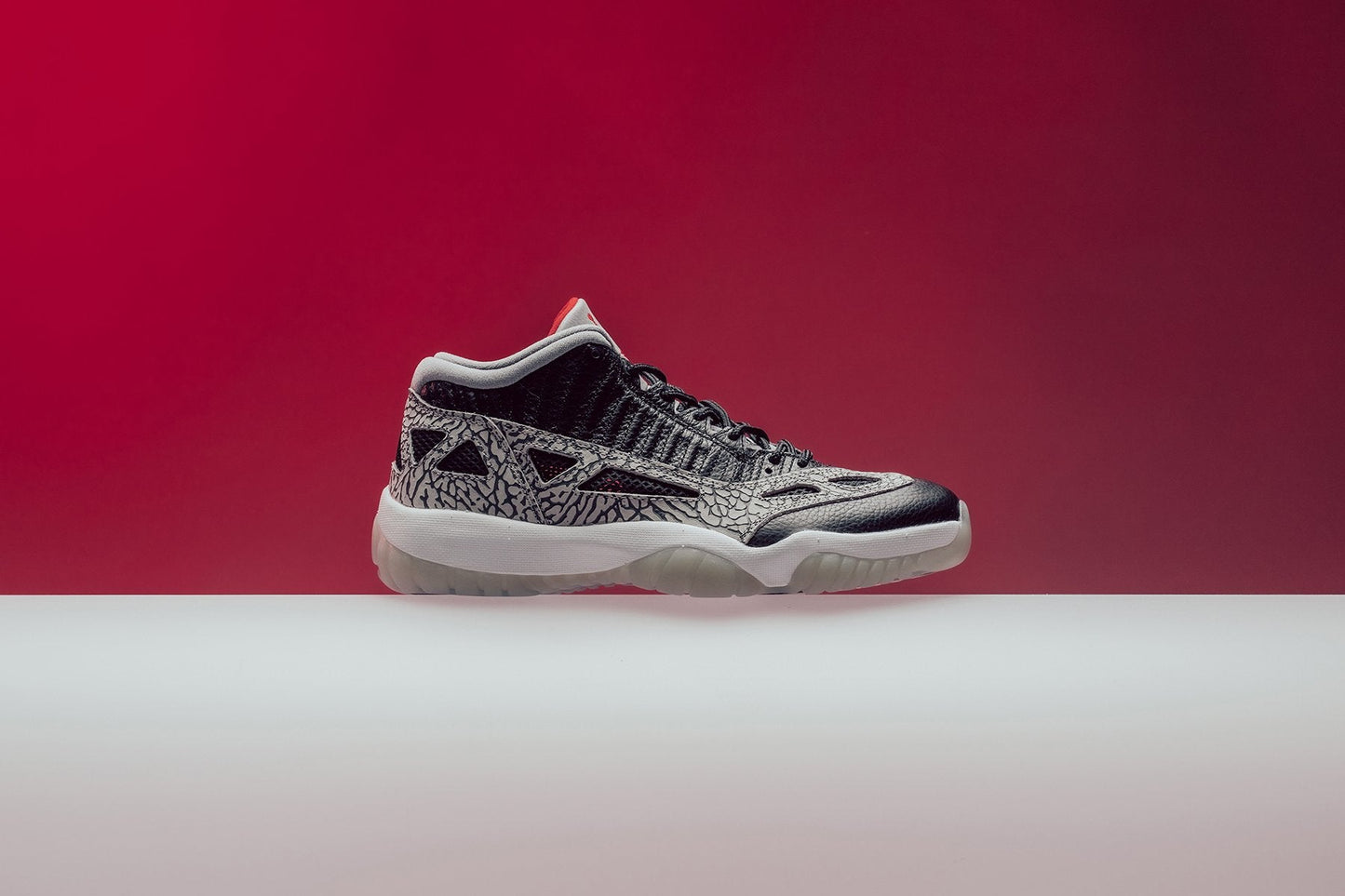 Air Jordan 11 Retro Low IE "Black Cement" - Black/Fire Red