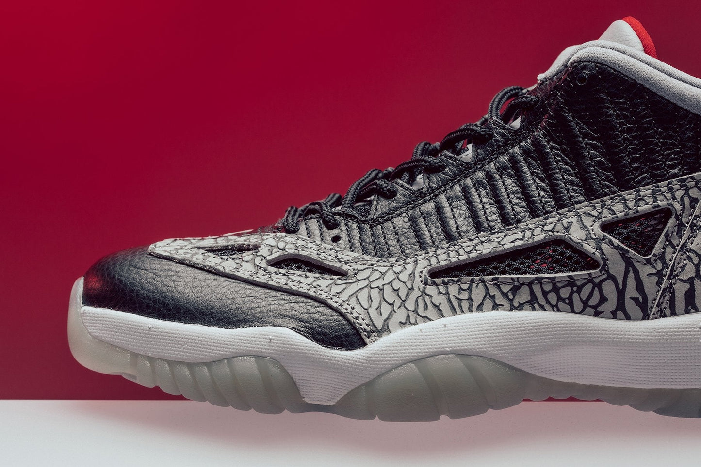 Air Jordan 11 Retro Low IE "Black Cement" - Black/Fire Red