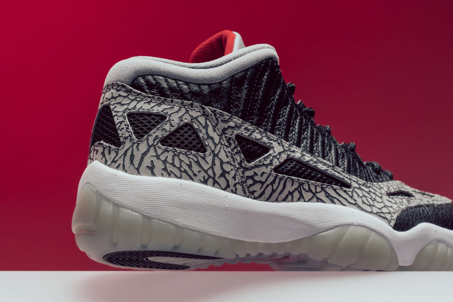 Air Jordan 11 Retro Low IE "Black Cement" - Black/Fire Red